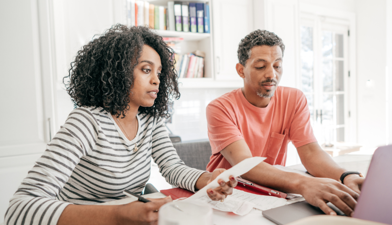 Woman and man navigating complex financial decisions